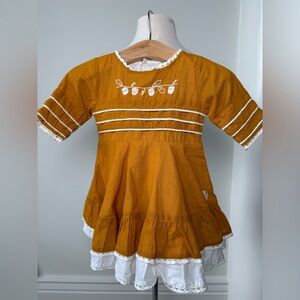 Charming Yellow Baby Dress with White Trim